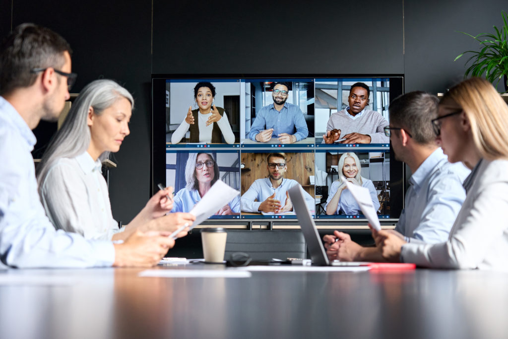 Global corporation online videoconference in meeting room