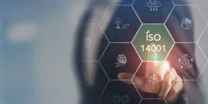 stock image of an IT manager pointing to an ISO 14001 sign